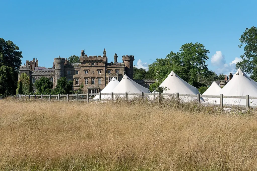 Bell tent village in open countryside