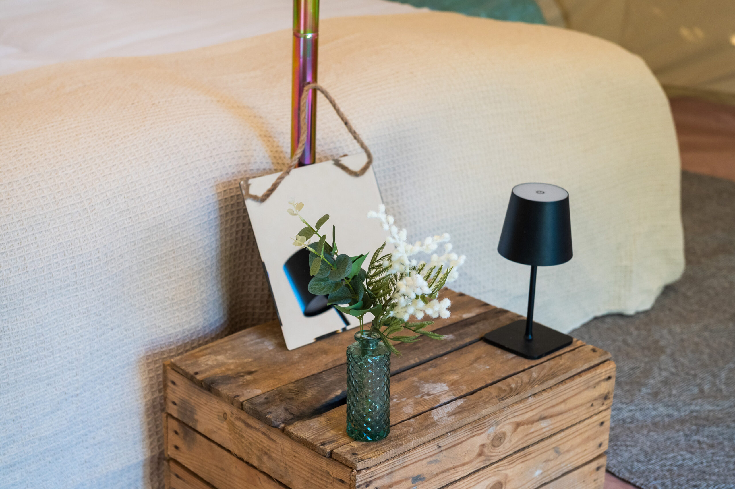 Bell tent interior styling - rugs, cushions, dried flowers